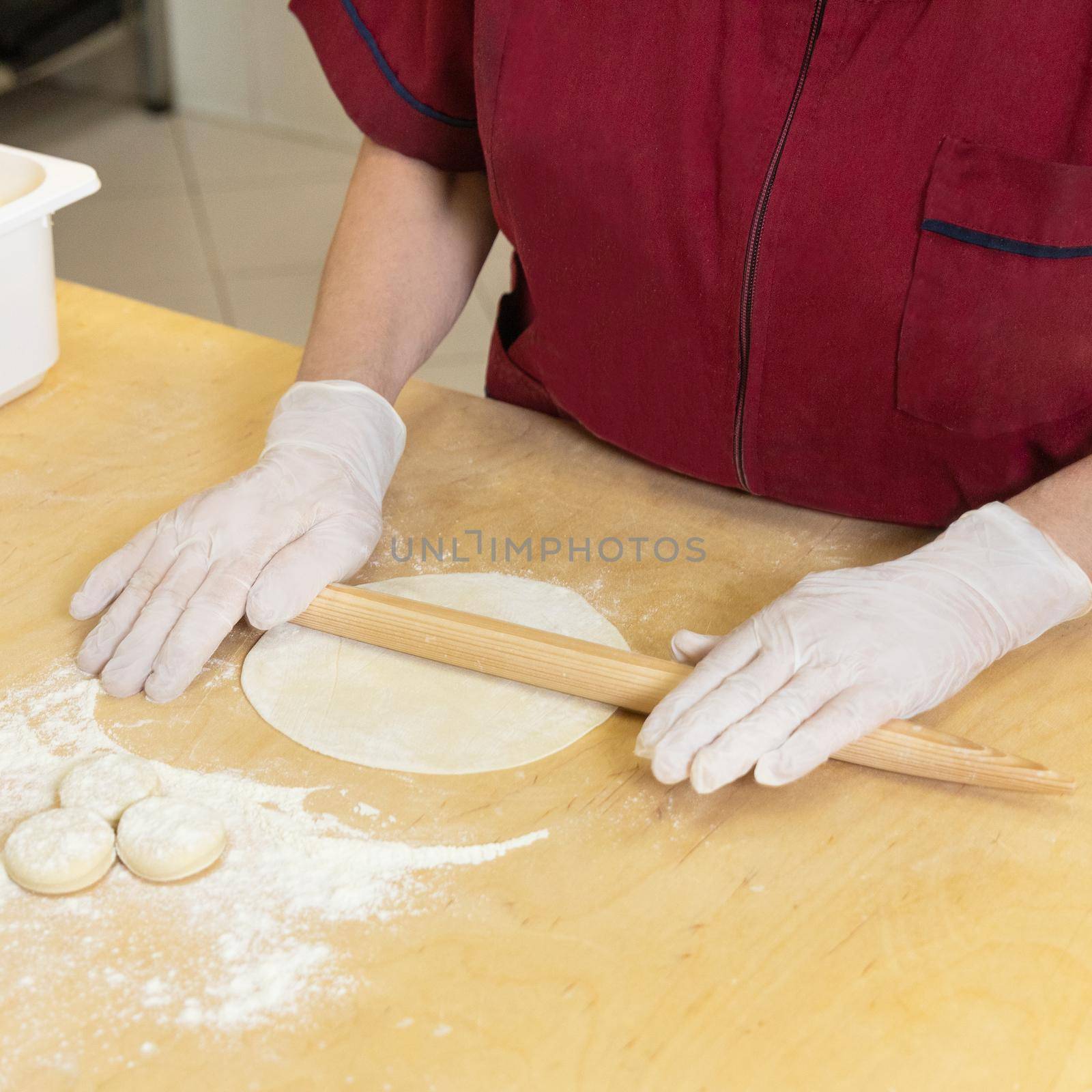 Woman making qutab meal from dough