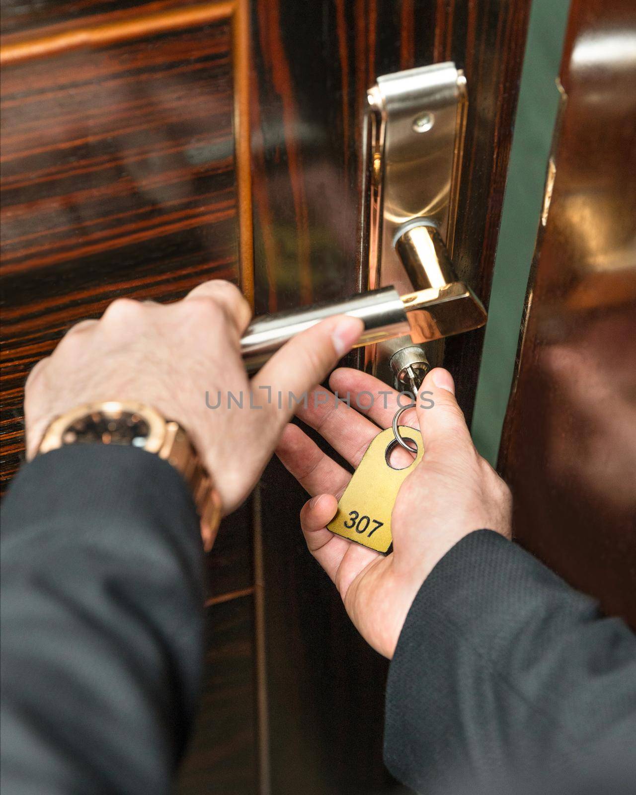 Opening the hotel room door with a key by ferhad