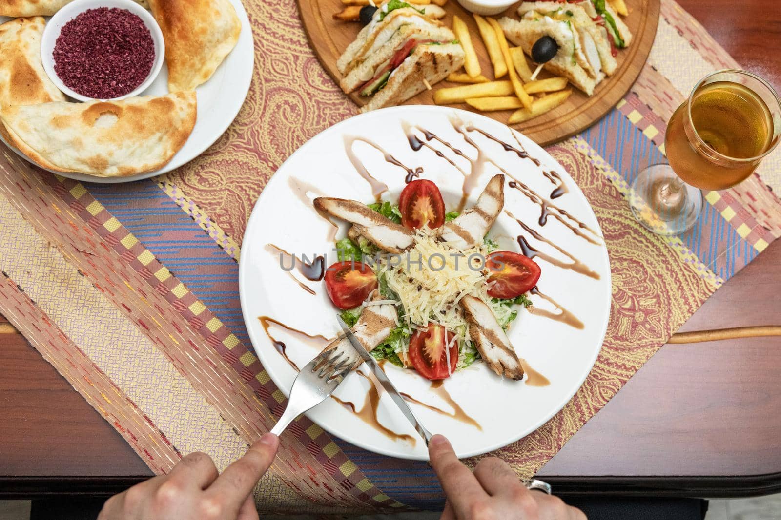 Man eating beautiful chicken salad, top view