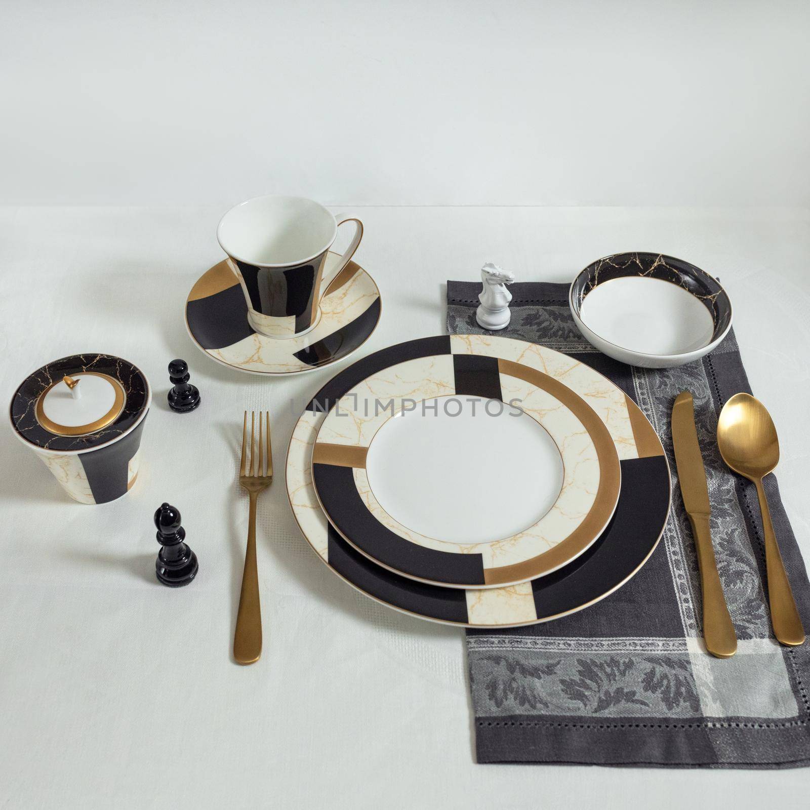 Set of clean tableware, dishes, plates, utensils on the table