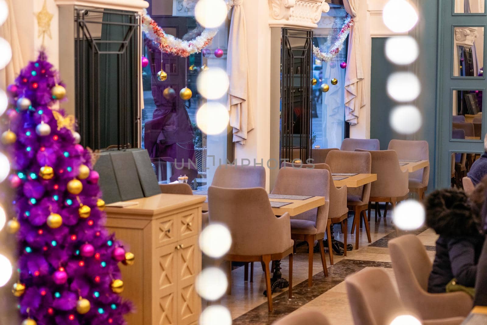 Purple Christmas tree in the restaurant interior by ferhad