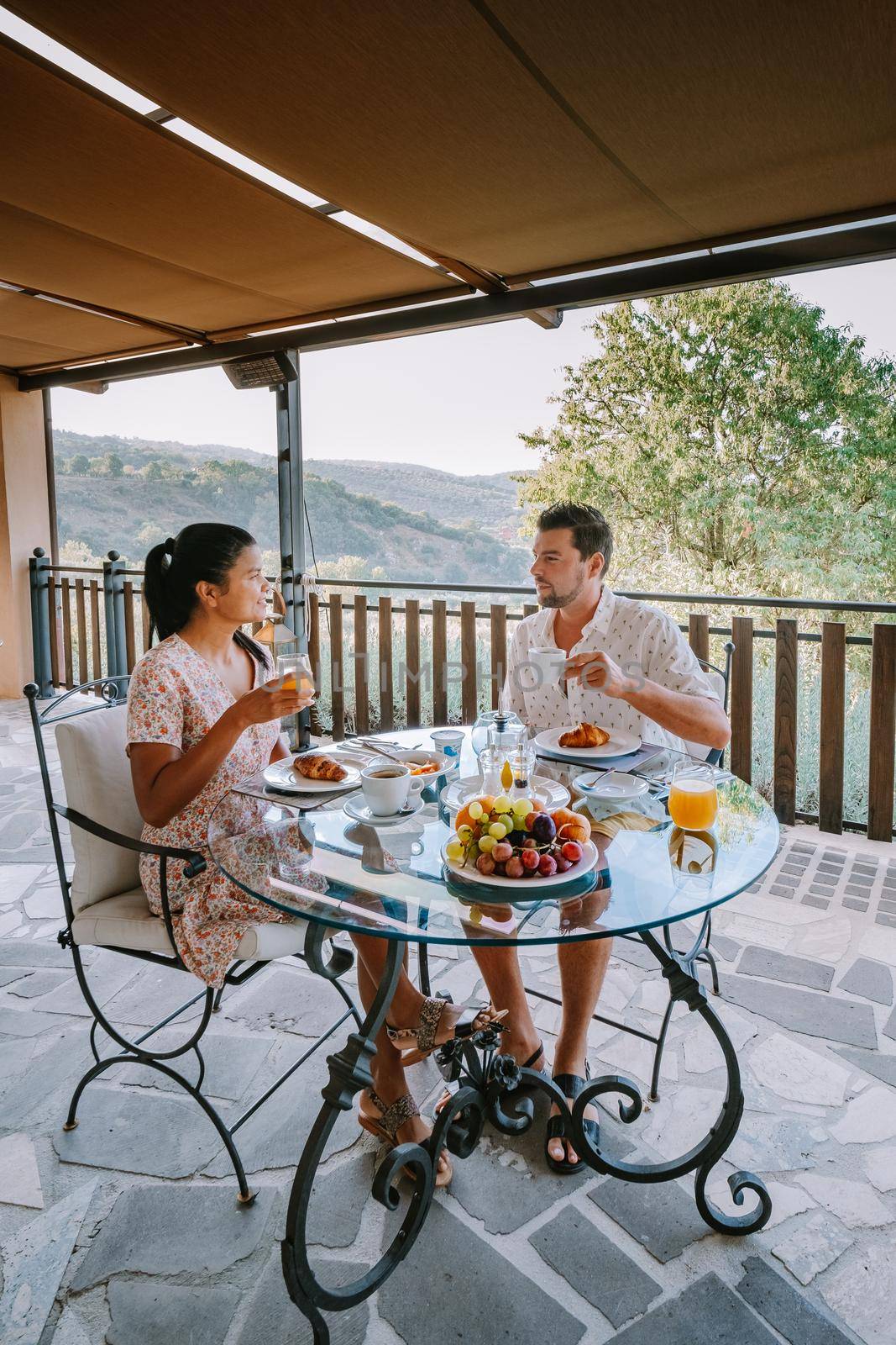 couple having breakfast at luxury villa at the Italian country side near Rome Italy. 