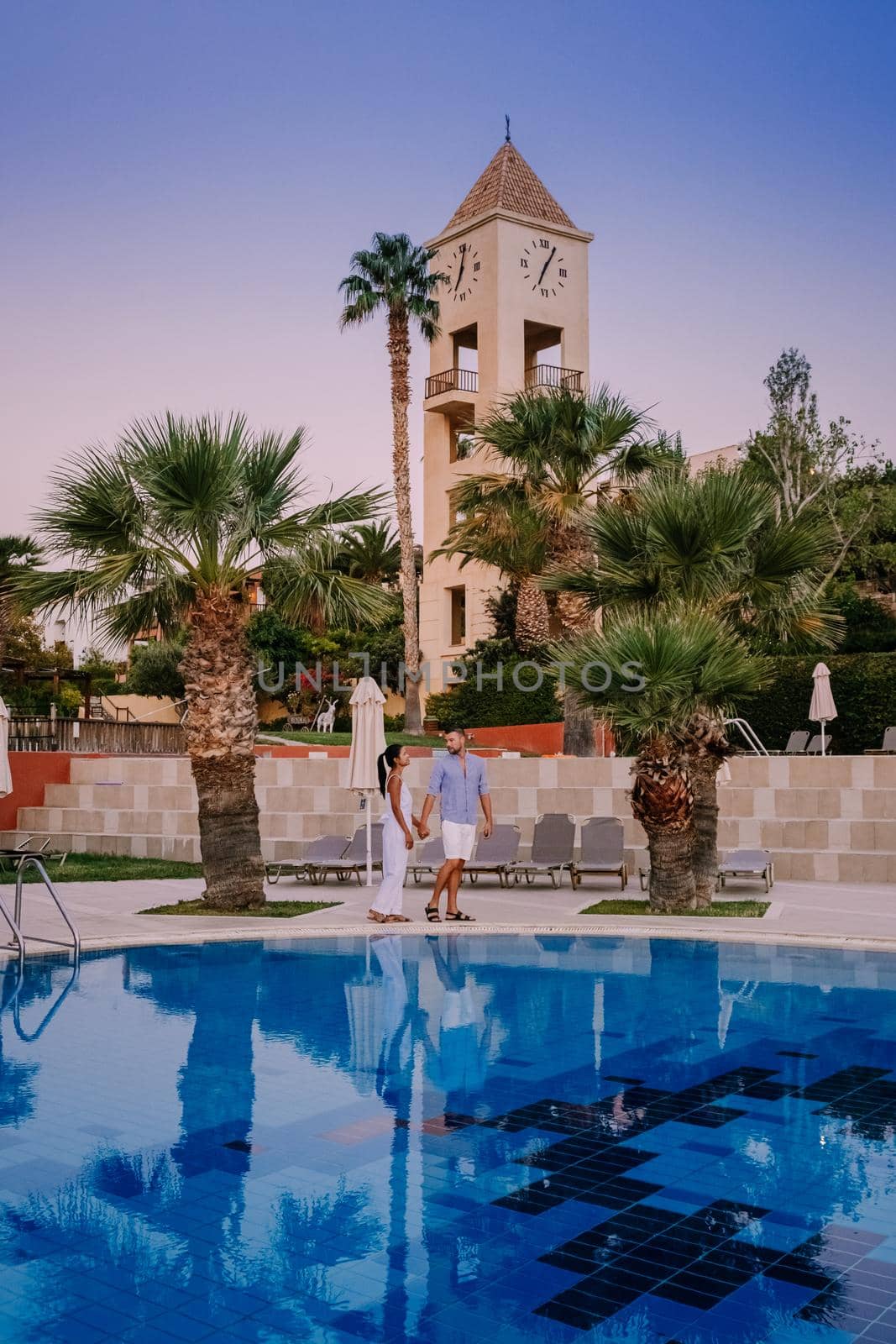 Crete Greece, Candia park village a luxury holiday village in Crete Greece by the ocean in traditional colors. Couple on vacation luxury resort