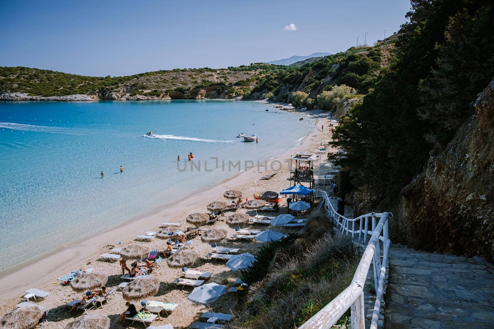 Tropical beach of Voulisma beach, Istron, Crete, Greece, couple on vacation in Greece by fokkebok