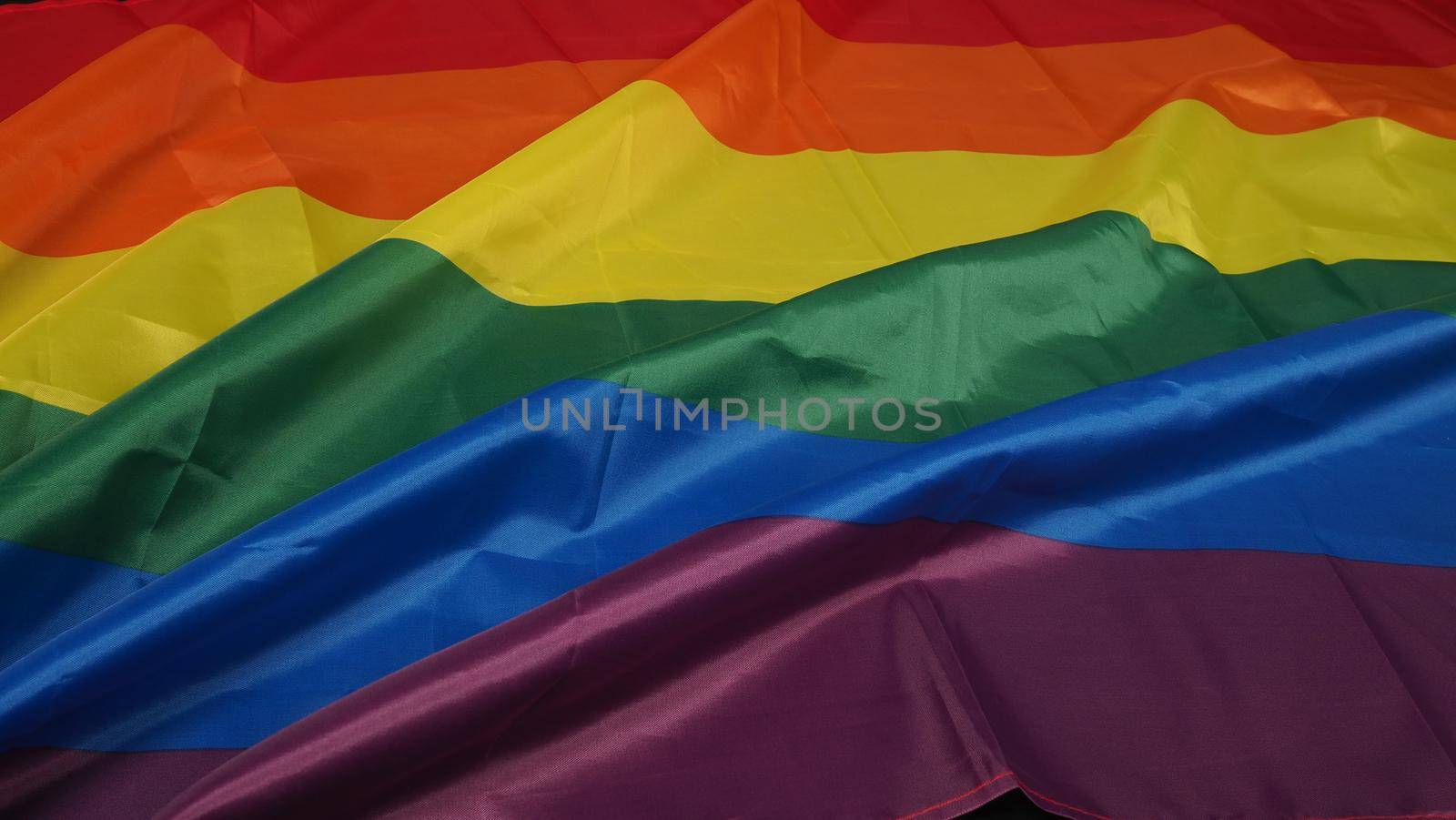 LGBTQ flag or Lesbian Gay Bi sexsual Transgender Queer or homosexsual pride Rainbow flag on black background. Represent hand symbol of freedom, peace, equality and love. LGBTQ concept