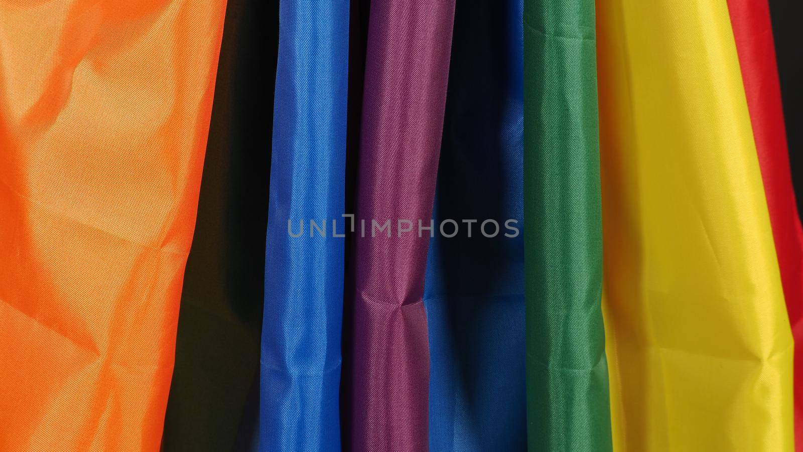 LGBTQ flag or Lesbian Gay Bi sexsual Transgender Queer or homosexsual pride Rainbow flag on black background. Represent hand symbol of freedom, peace, equality and love. LGBTQ concept