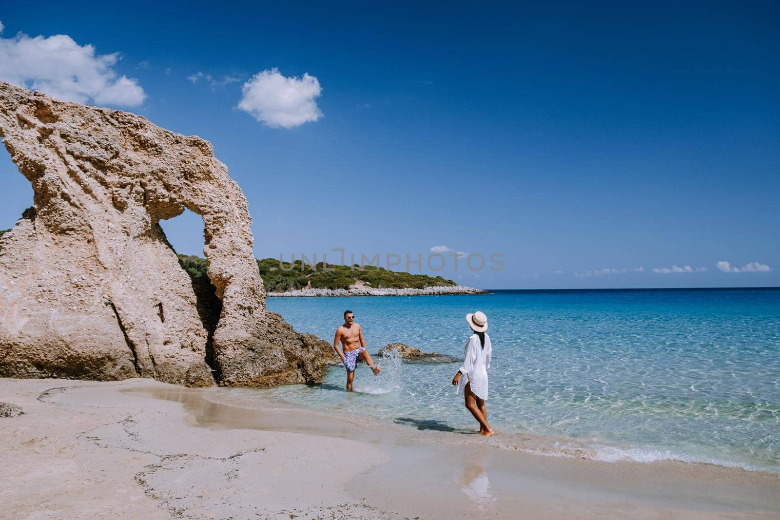 Tropical beach of Voulisma beach, Istron, Crete, Greece, couple on vacation in Greece by fokkebok