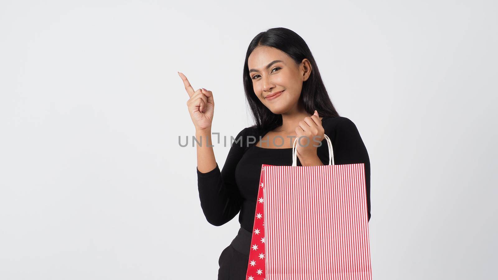 Sexy woman shopping. Portrait of beautiful girl holding shopping bags by gnepphoto