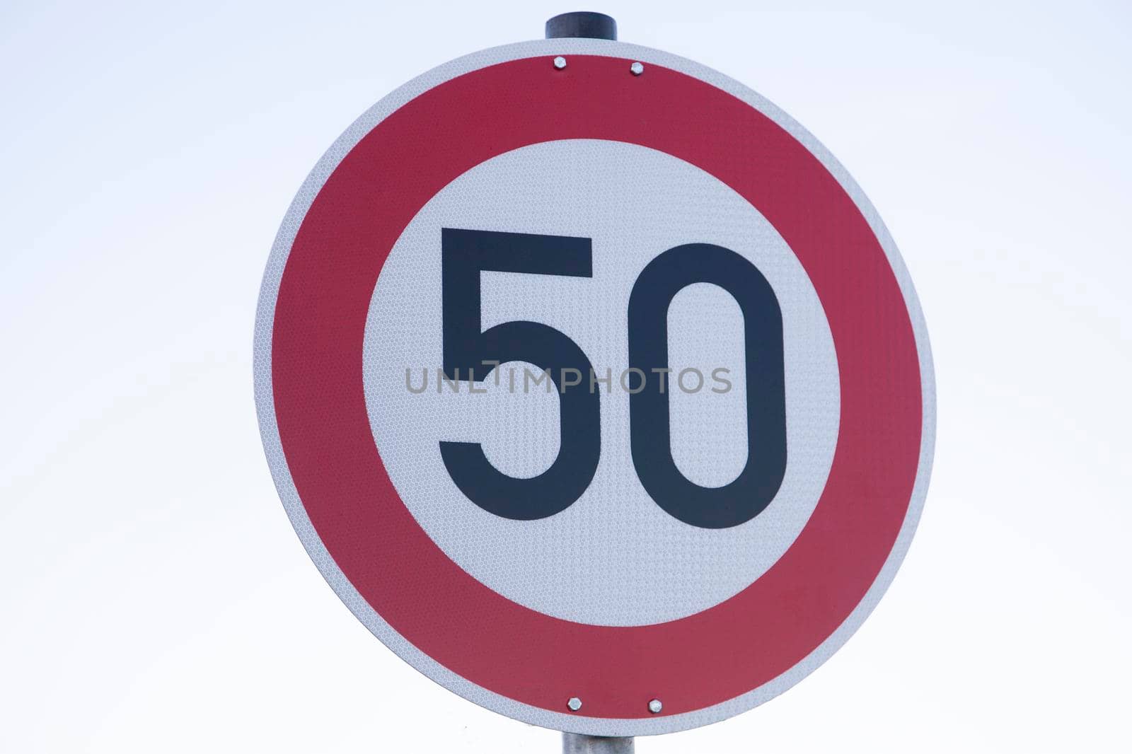 Speed limit traffic sign on white background by Kasparart