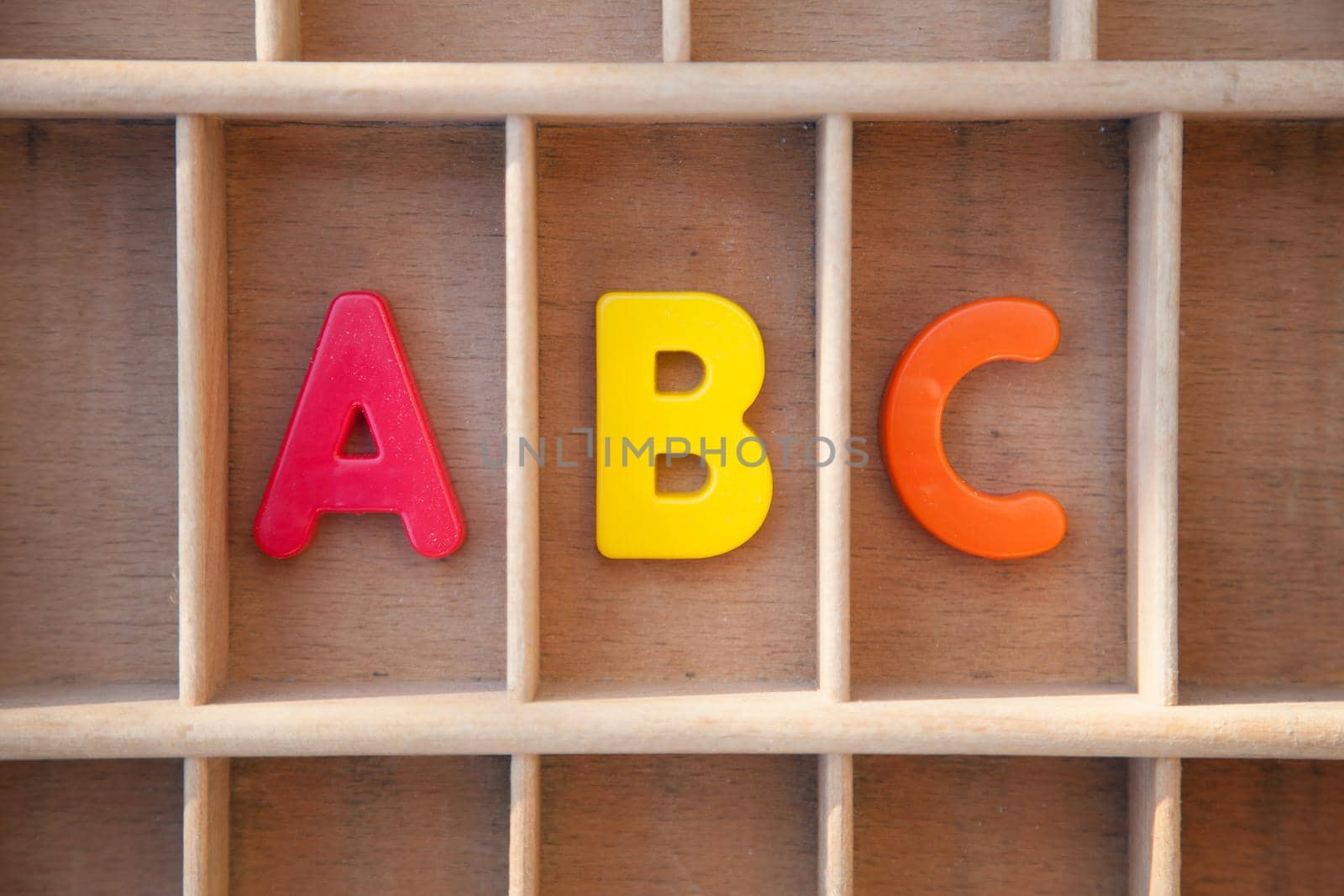 Alphabet letters in a wooden letter case