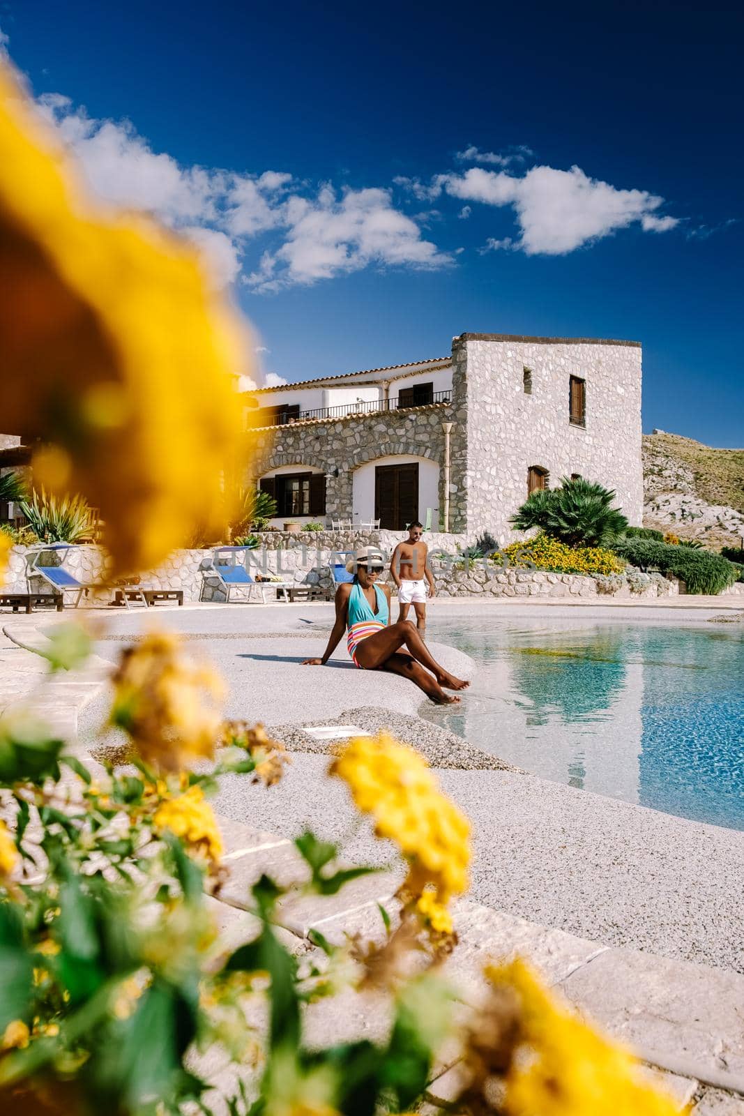 Agriturismo bed and breakfast at Sicily Italy, beautiful historical old farm renovated as BB Sicilia, a couple on vacation at Sicilian luxury agriturismo