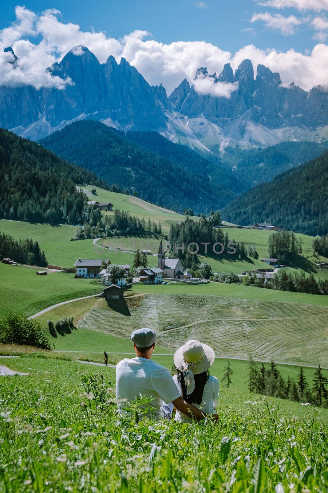 couple on vacation Santa Magdalena Village in Dolomites area Italy, couple on vacation Val Di Funes Italian Dolomites by fokkebok
