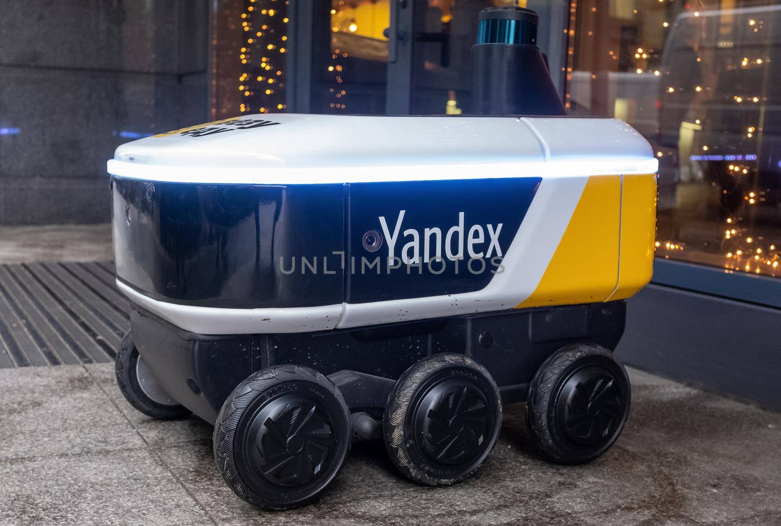 December 14, 2020, Moscow Russia. An unmanned robot courier for delivering food from the Yandex.Rover cafe at the entrance to a restaurant in Moscow.