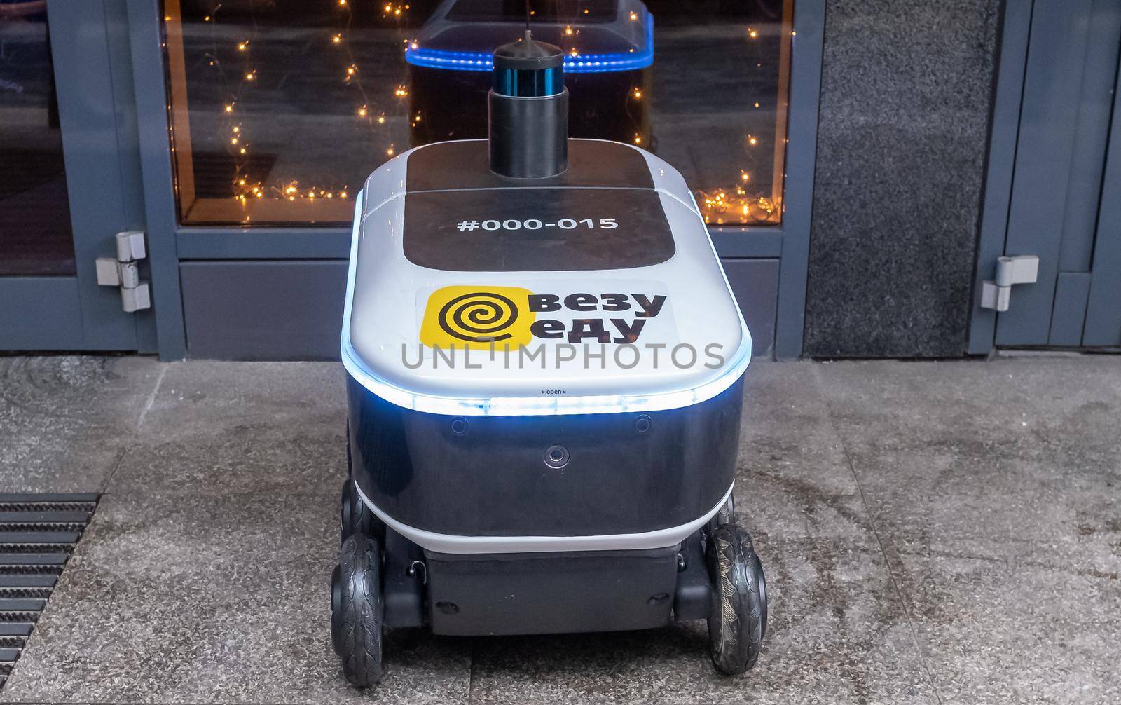 December 14, 2020, Moscow Russia. An unmanned robot courier for delivering food from the Yandex.Rover cafe at the entrance to a restaurant in Moscow.