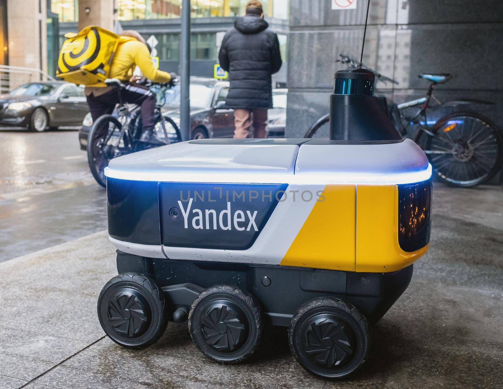 December 14, 2020, Moscow Russia. An unmanned robot courier for delivering food from the Yandex.Rover cafe at the entrance to a restaurant in Moscow.