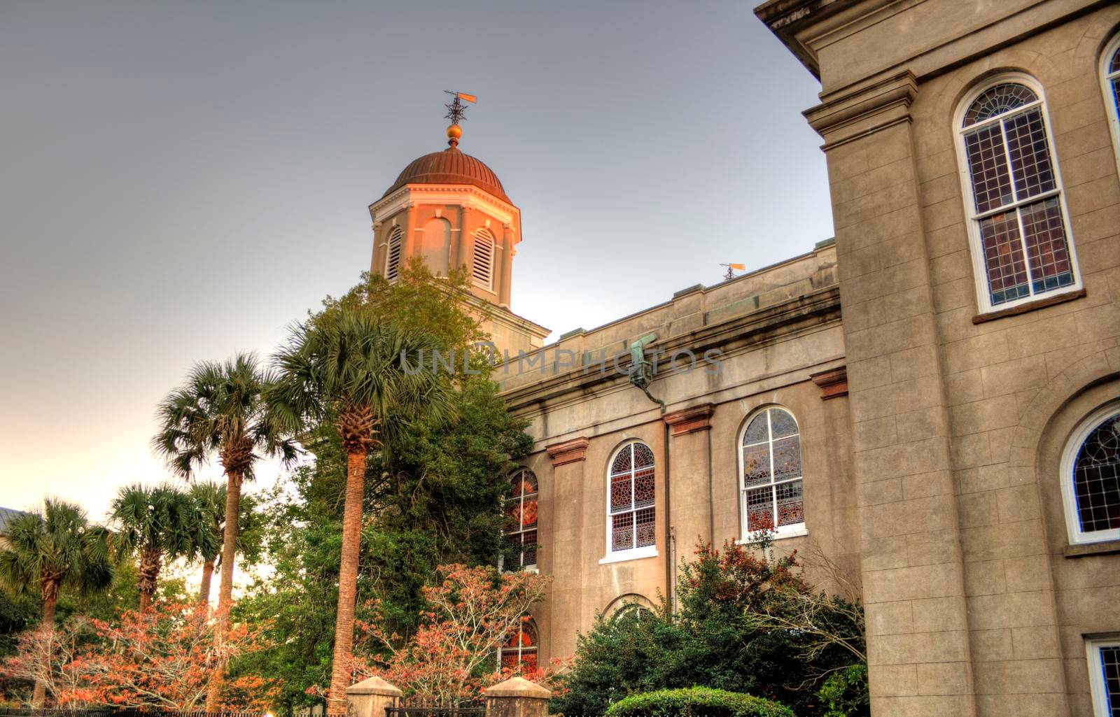 A setting sun makes a church glow in Charleston, South Carolina