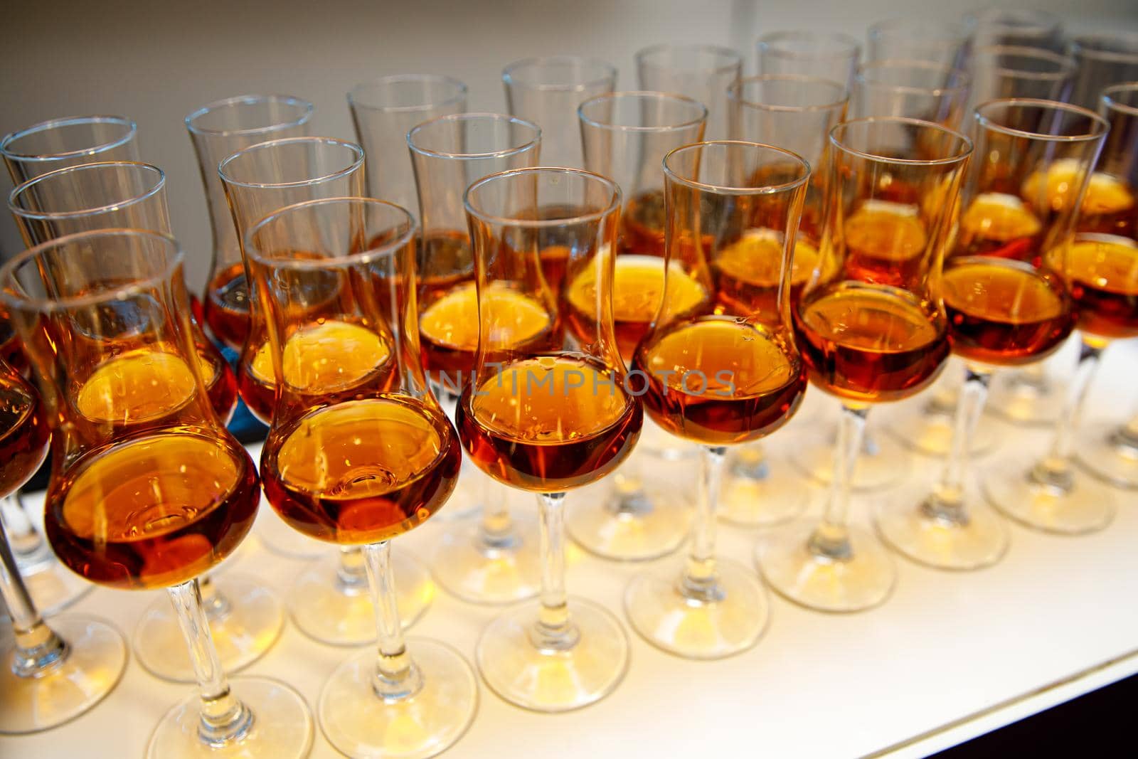 A lot of glasses with cognac by 9parusnikov