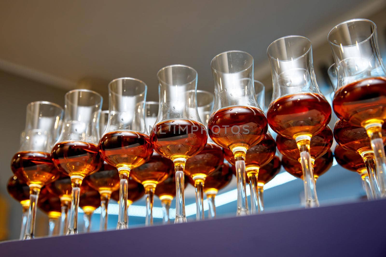 A lot of glasses with cognac.