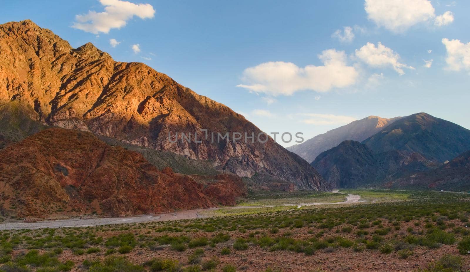 Wide green mountain valley in Uspallata, Mendoza, Argentina.