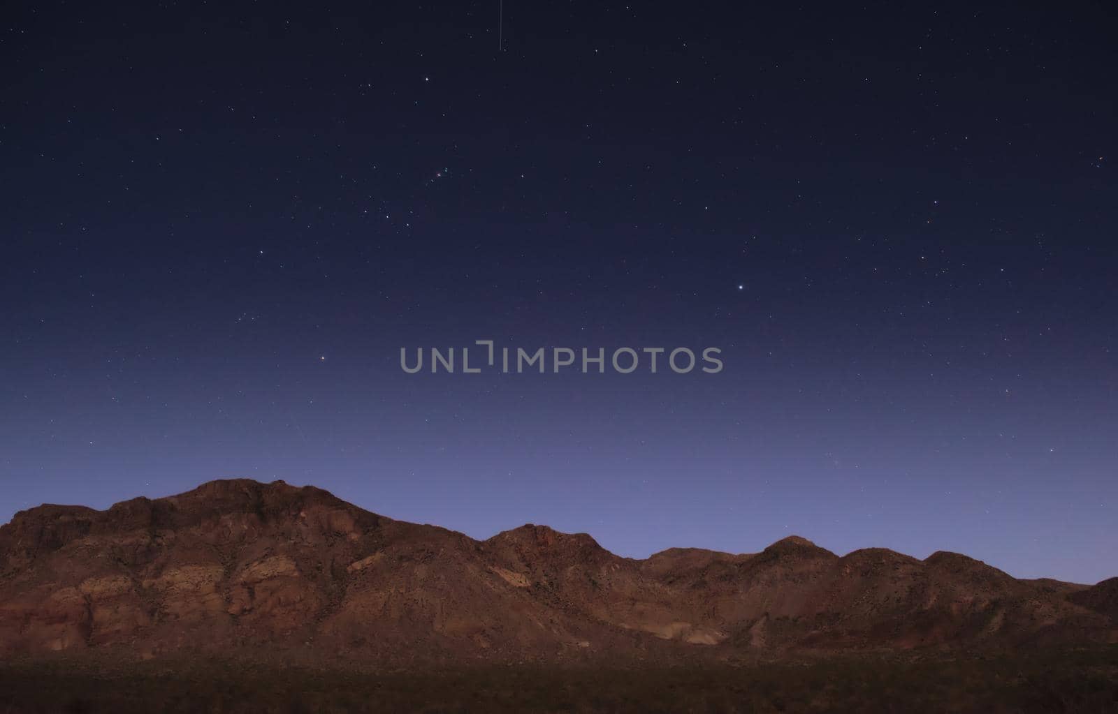 Starry night sky over the mountains near Uspallata, Mendoza, Argentina. by hernan_hyper