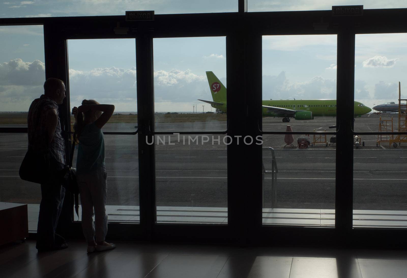 SIMFEROPOL, RUSSIA, JULY 28, 2017 Silhouettes of passengers at the International Airport of Simferopol
