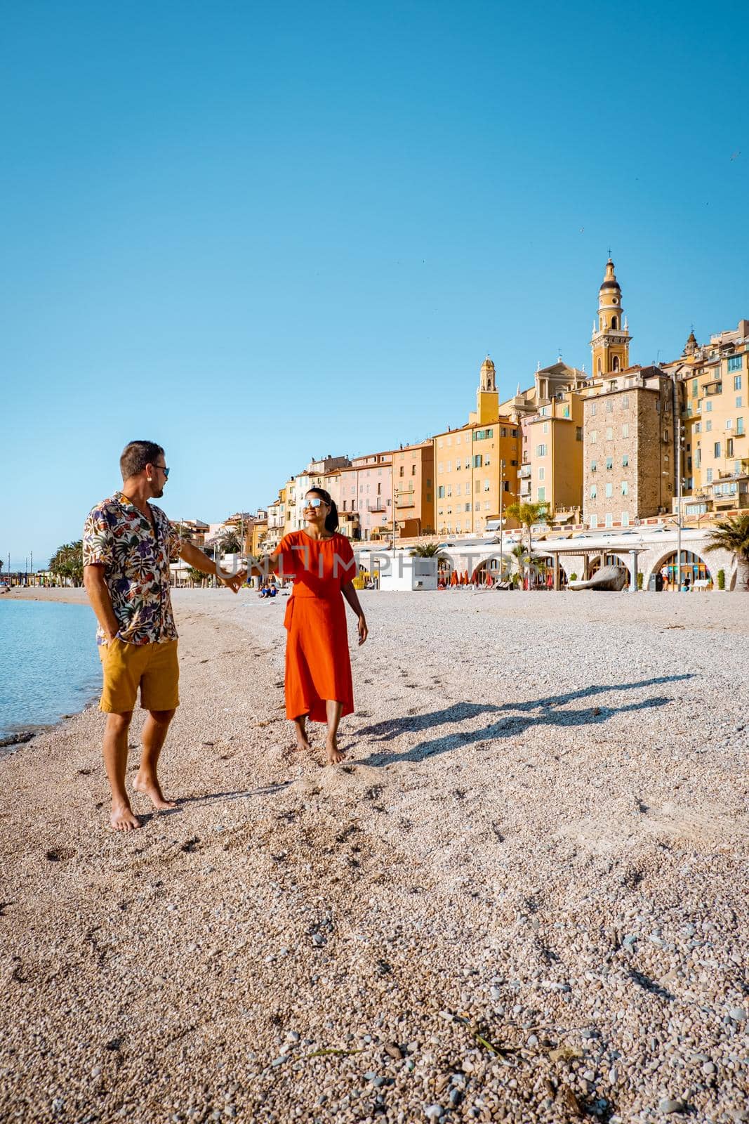 Menton France,couple men and woman on vacation at the Cote d Azur France, View on old part of Menton, Provence-Alpes-Cote d'Azur, France Europe