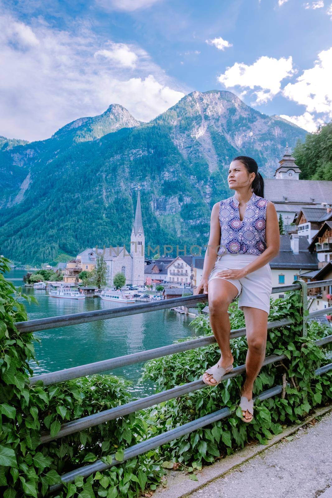 woman visit Hallstatt village on Hallstatter lake in Austrian Alps Austria by fokkebok