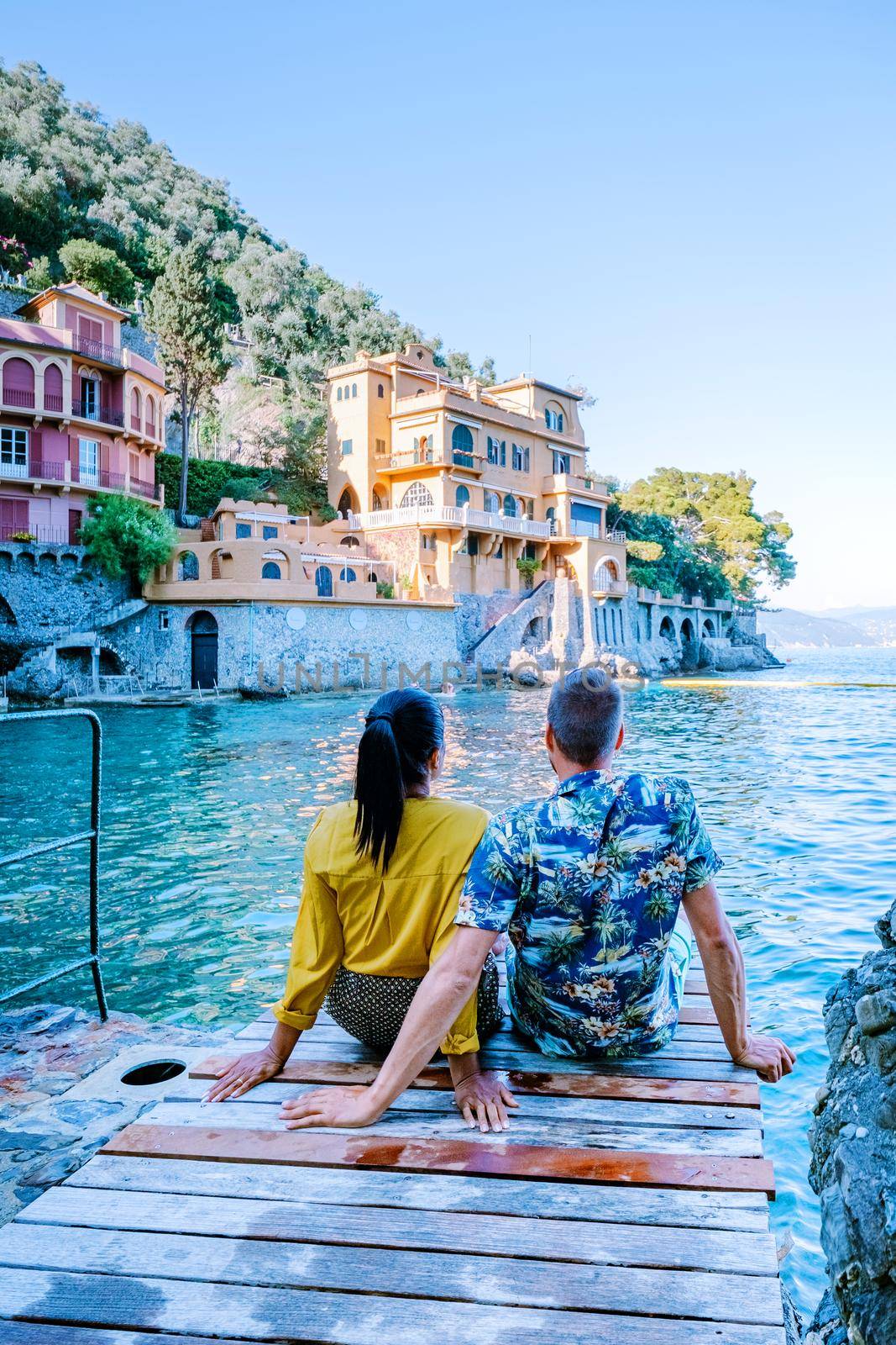 couple on vacation ligurian coast Italy, Portofino famous village bay, Italy colorful village Ligurian coast by fokkebok