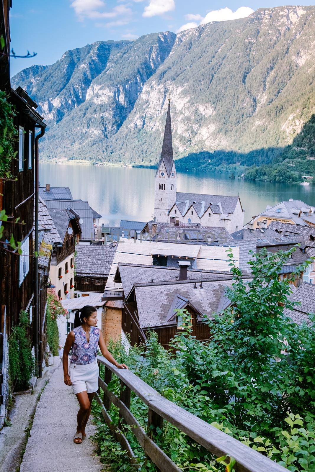 woman visit during summer vacation Hallstatt village on Hallstatter lake in Austrian Alps Austria Europe