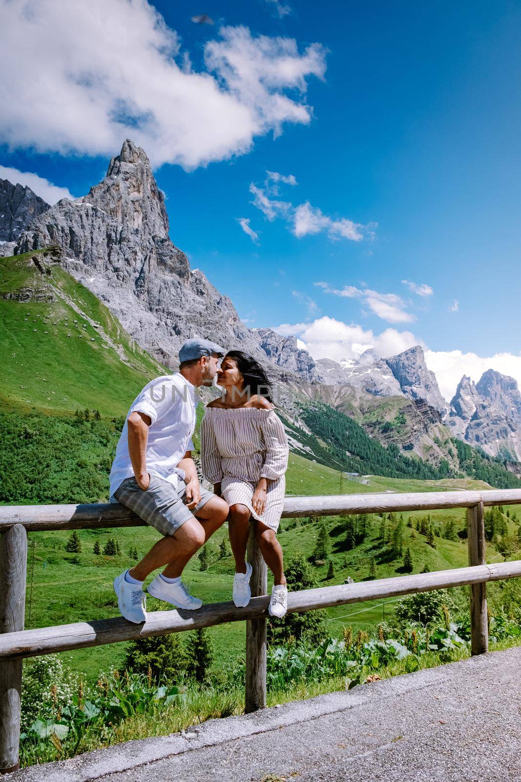 Pale di San Martino from Baita Segantini - Passo Rolle italy,Couple visit the italian Alps, View of Cimon della Pala, the best-know peak of the Pale di San Martino Group in the Dolomites, northern Italy by fokkebok