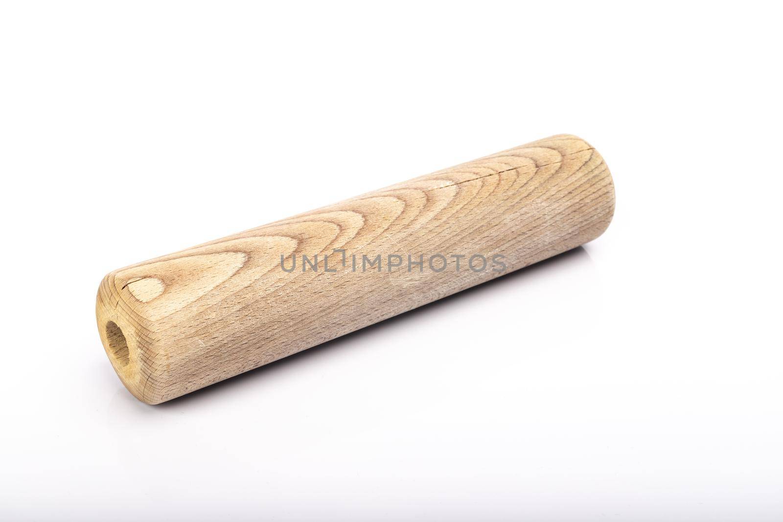 wooden rolling pin on white background in studio