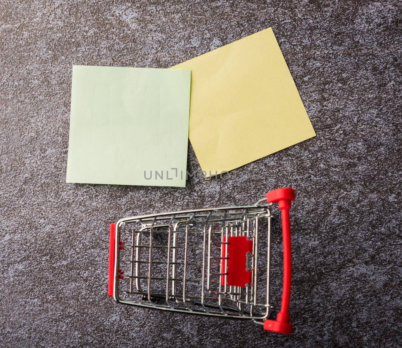 Blank paper stick note list with the shopping cart by Sorapop