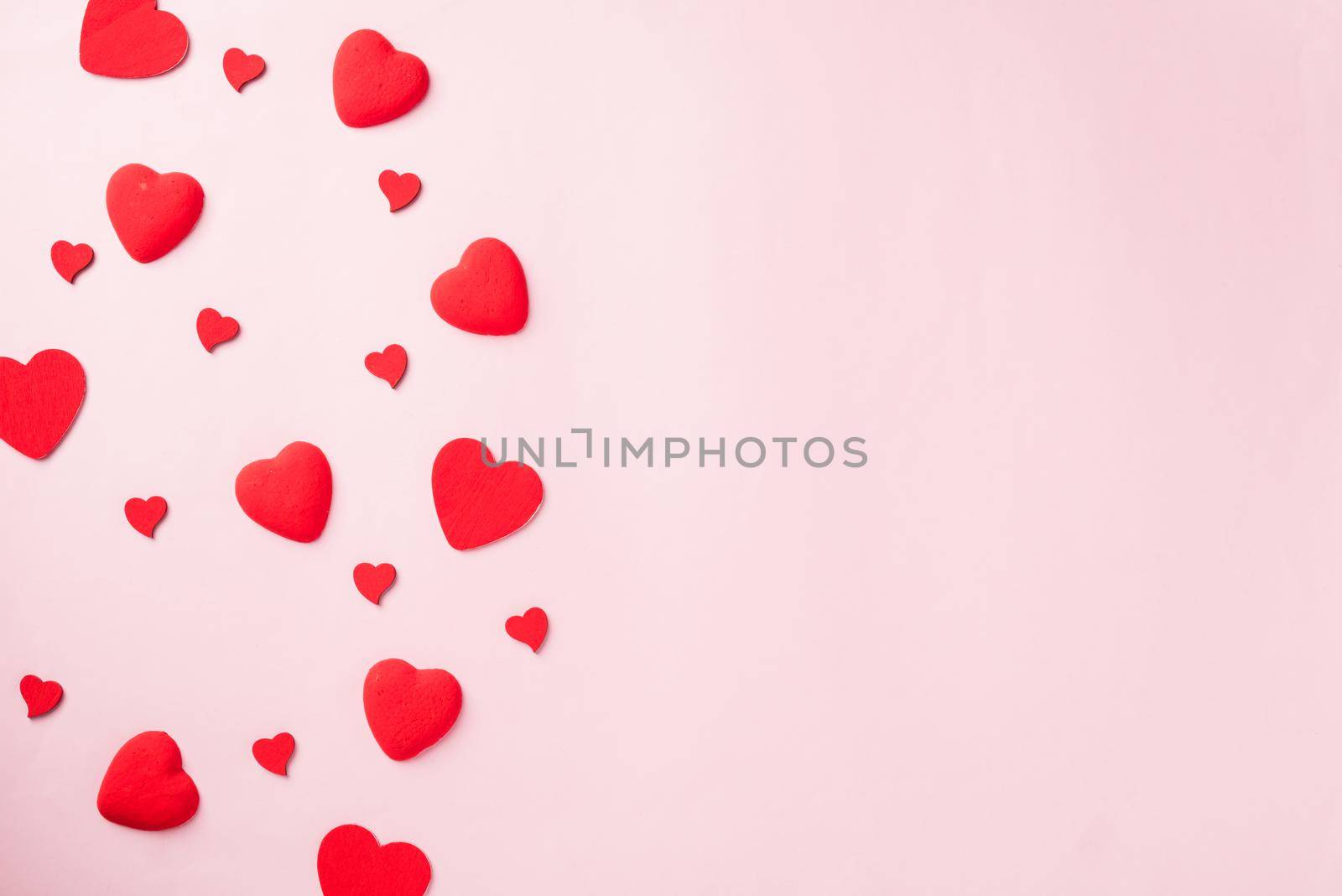 Valentines' day background. red hearts composition greeting card for love Valentines day concept isolated on pink background with copy space. Top View flat lay from above