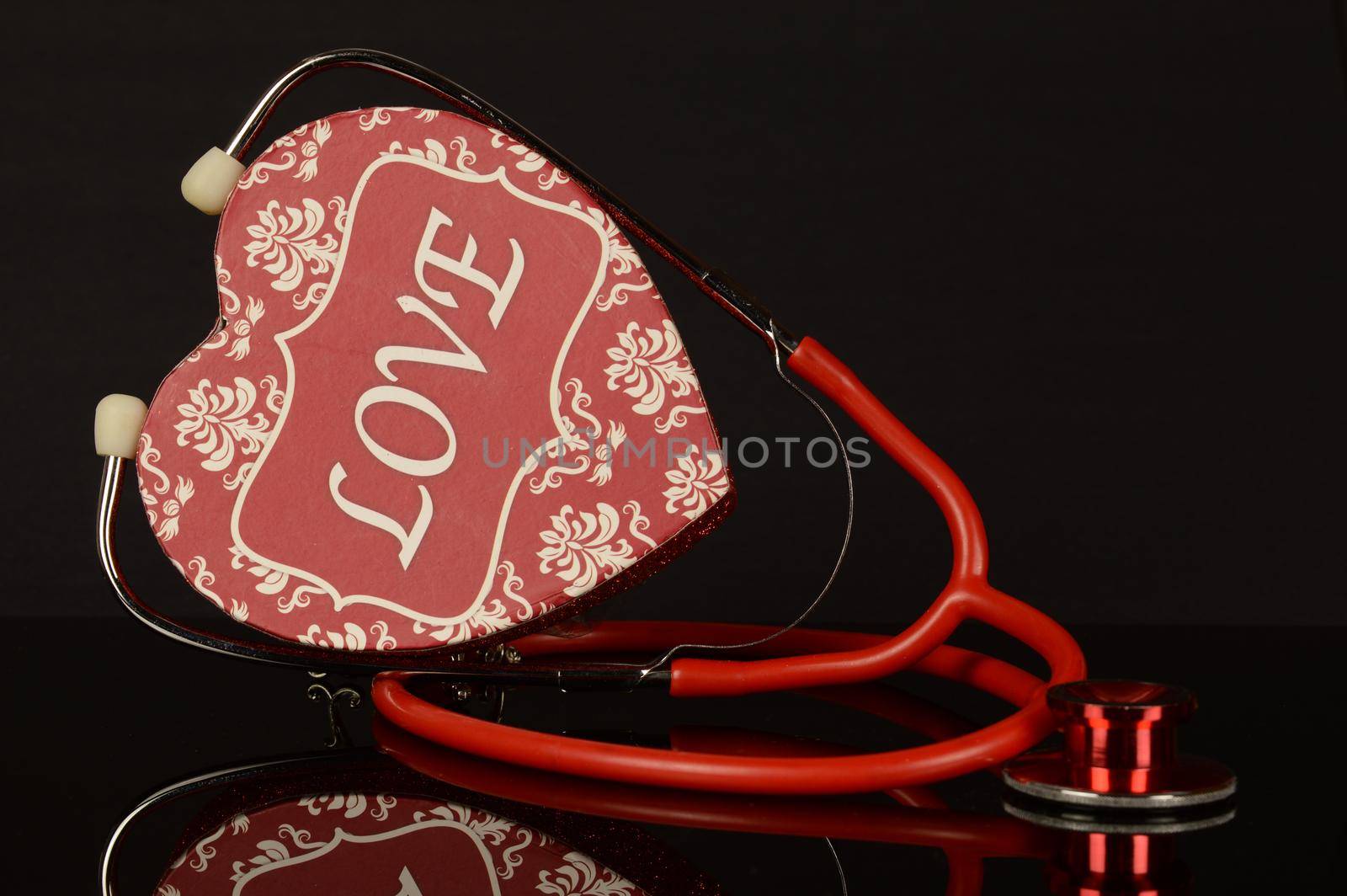 A red stethoscope and heart shaped box to remind us to love our hearts too.