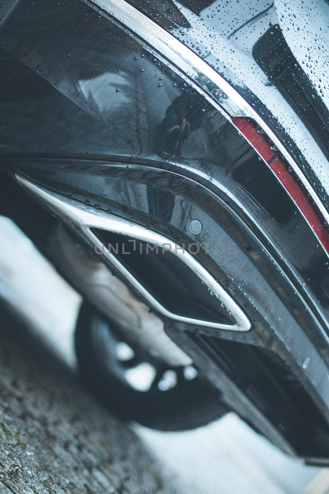 Close up of an exhaust pipe of a car, environmental pollution