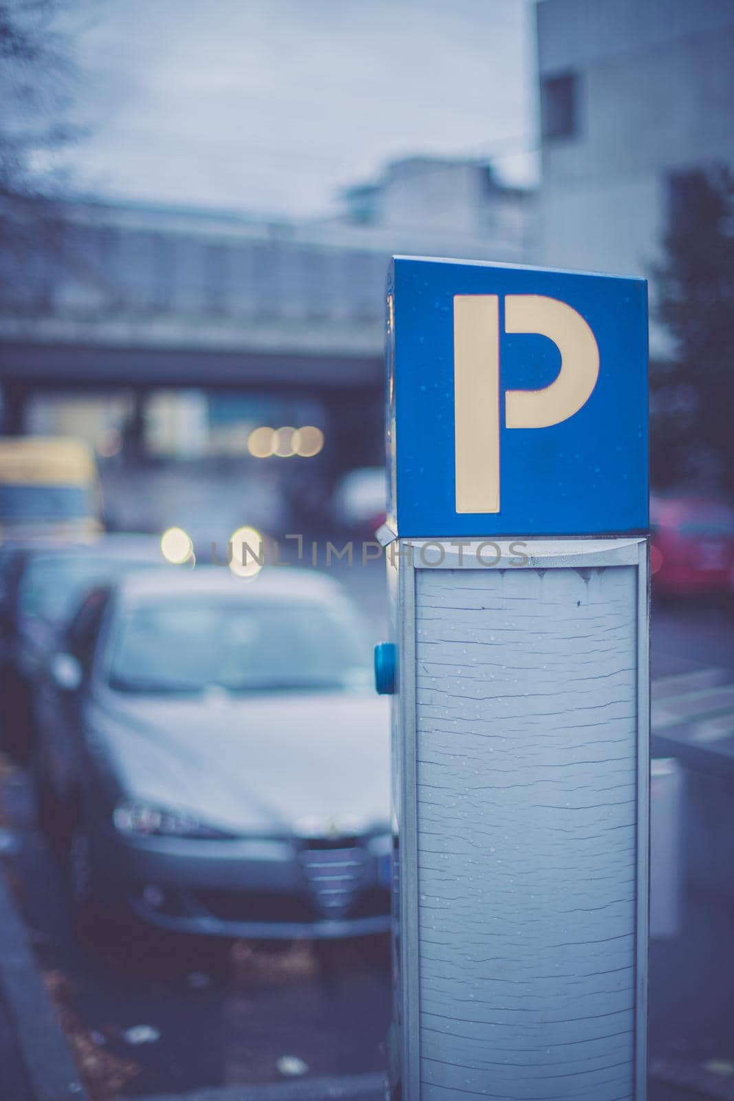 Parking machine in the city street, evening