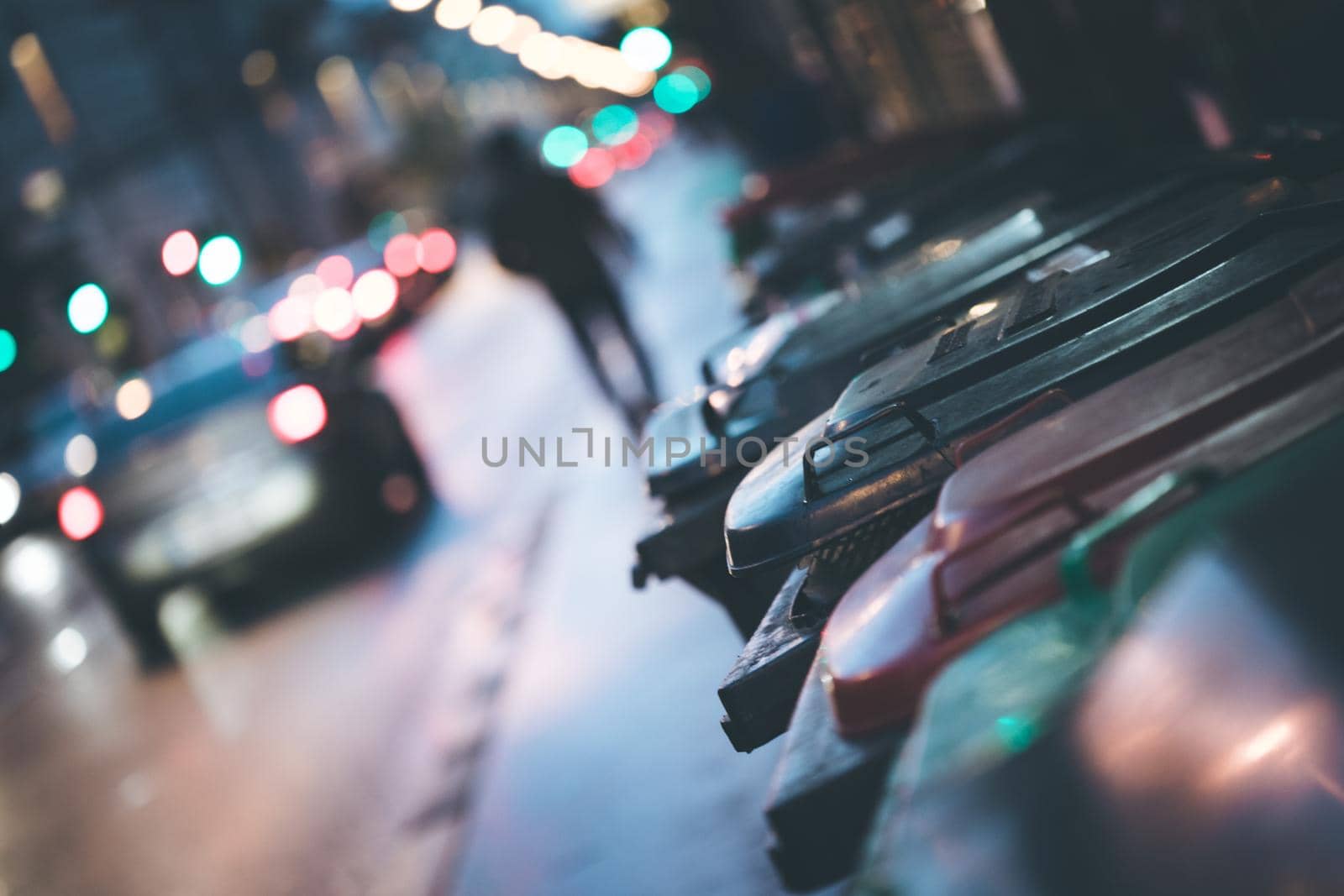 Urban street life with garbage container and street lights
