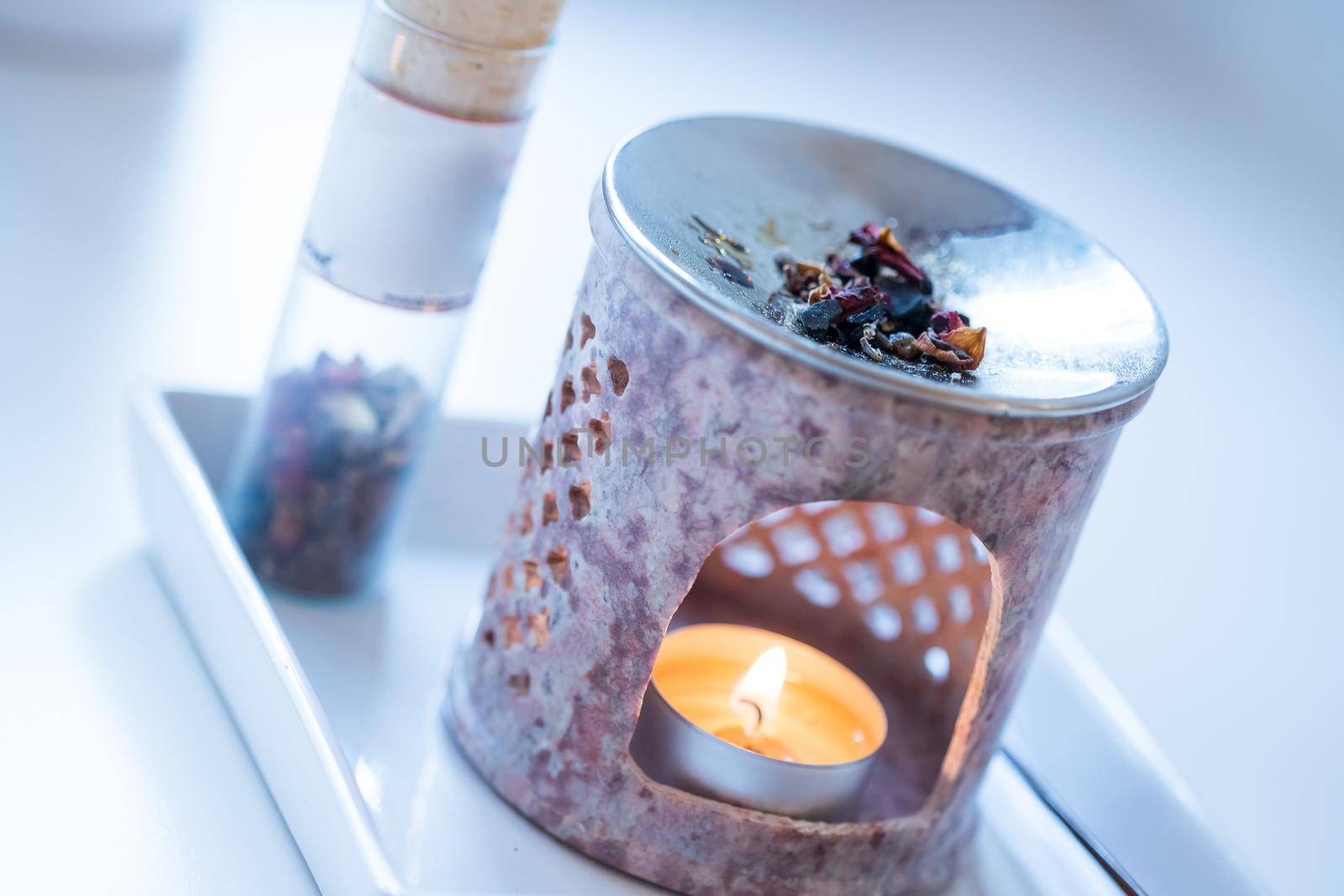 Close up picture of incense, candle