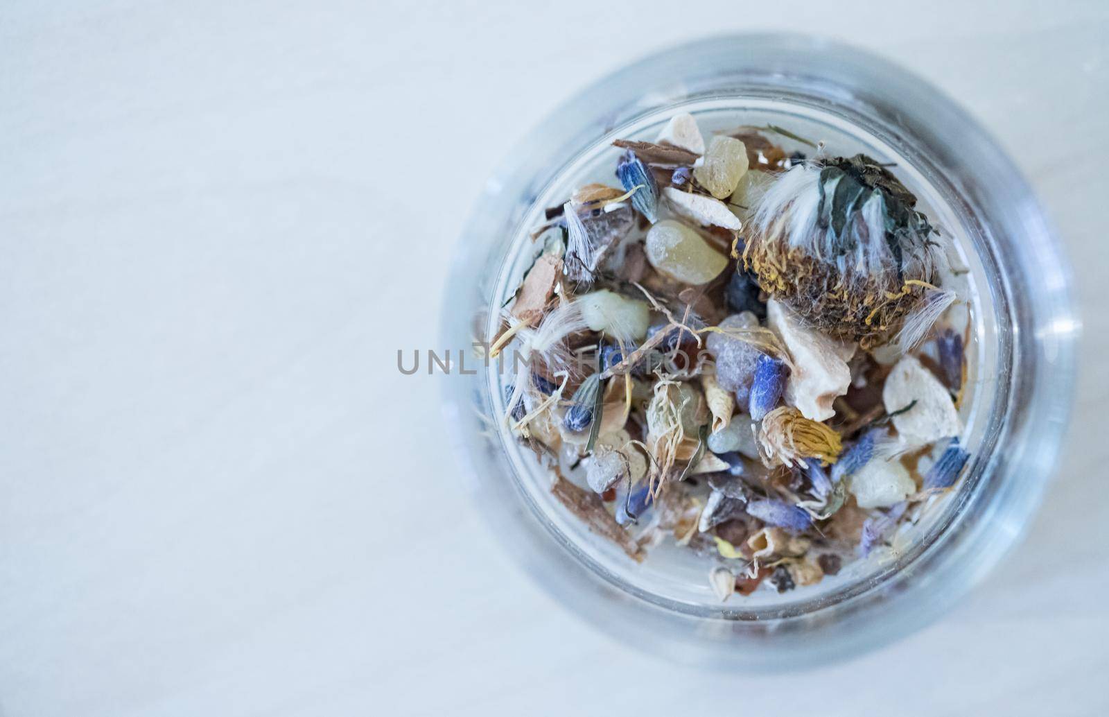 Close up picture of dried incense in a glass bowl