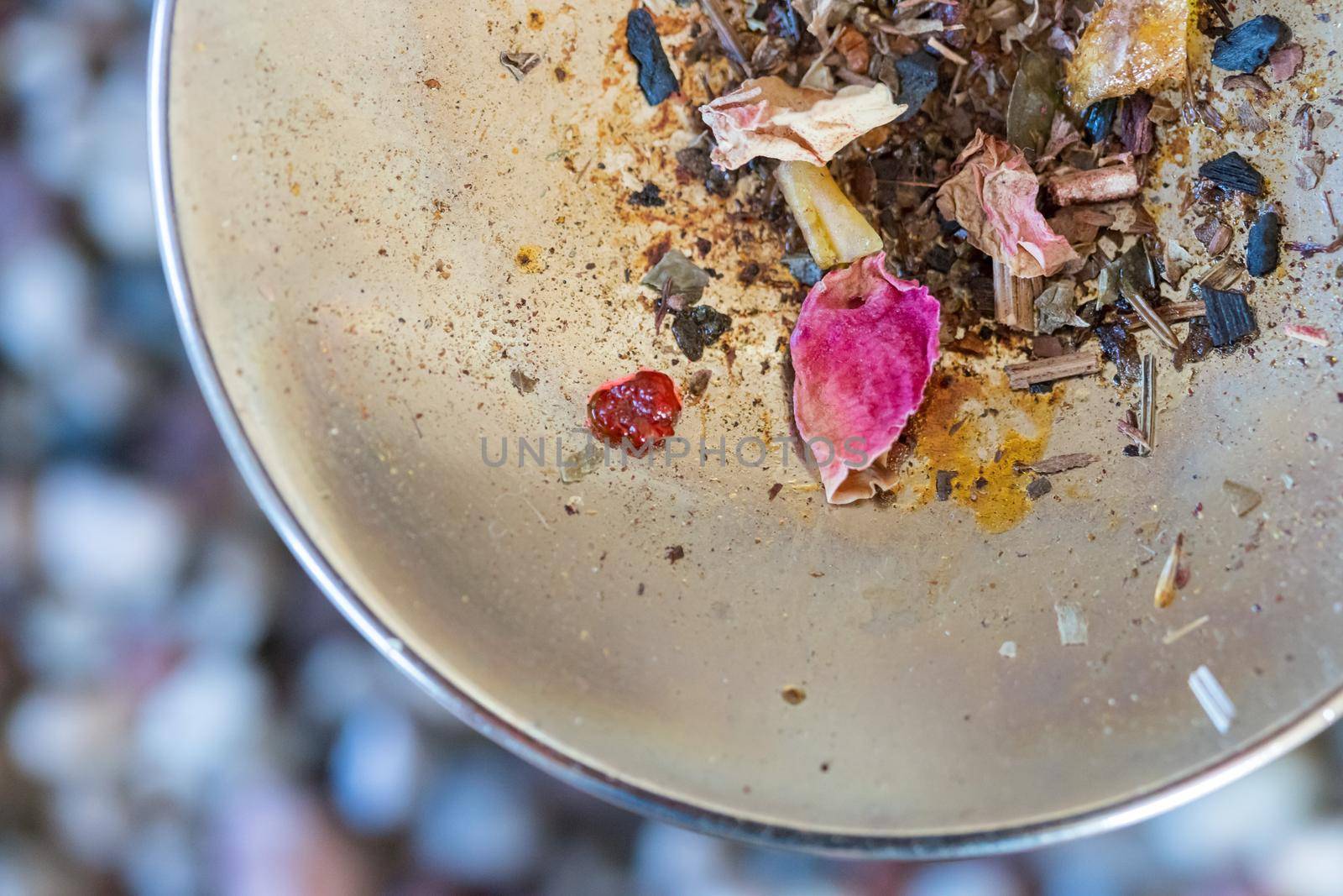 Close up picture of dried incense on a metal bowl