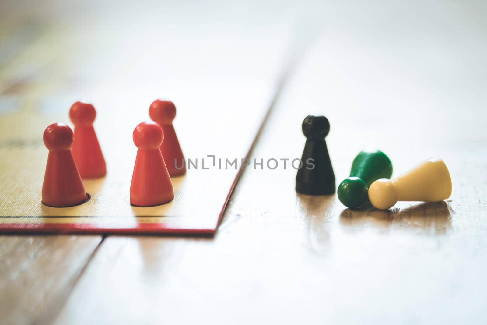 Meeples on a board, ready for playing a parlor game, ludo