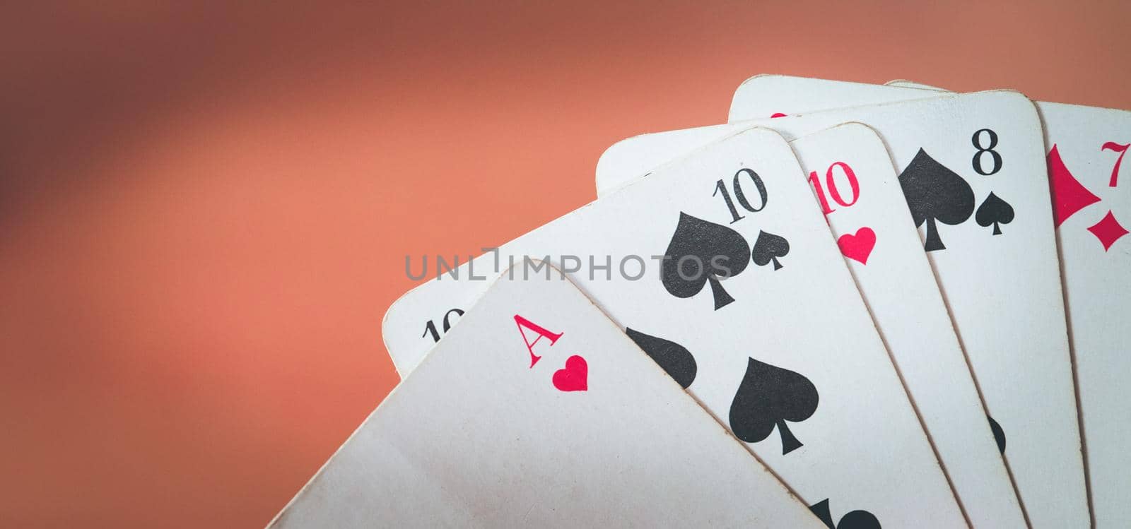 Man is playing cards, cutout of his hands