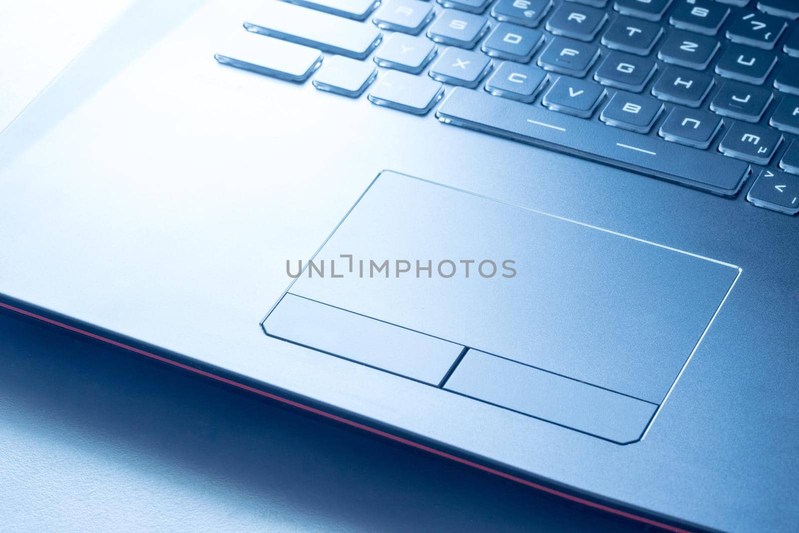 Closeup picture of a black laptop keyboard and touchpad