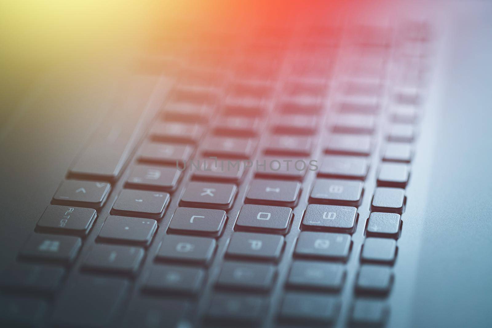 Closeup picture of a black laptop keyboard, Sunshine