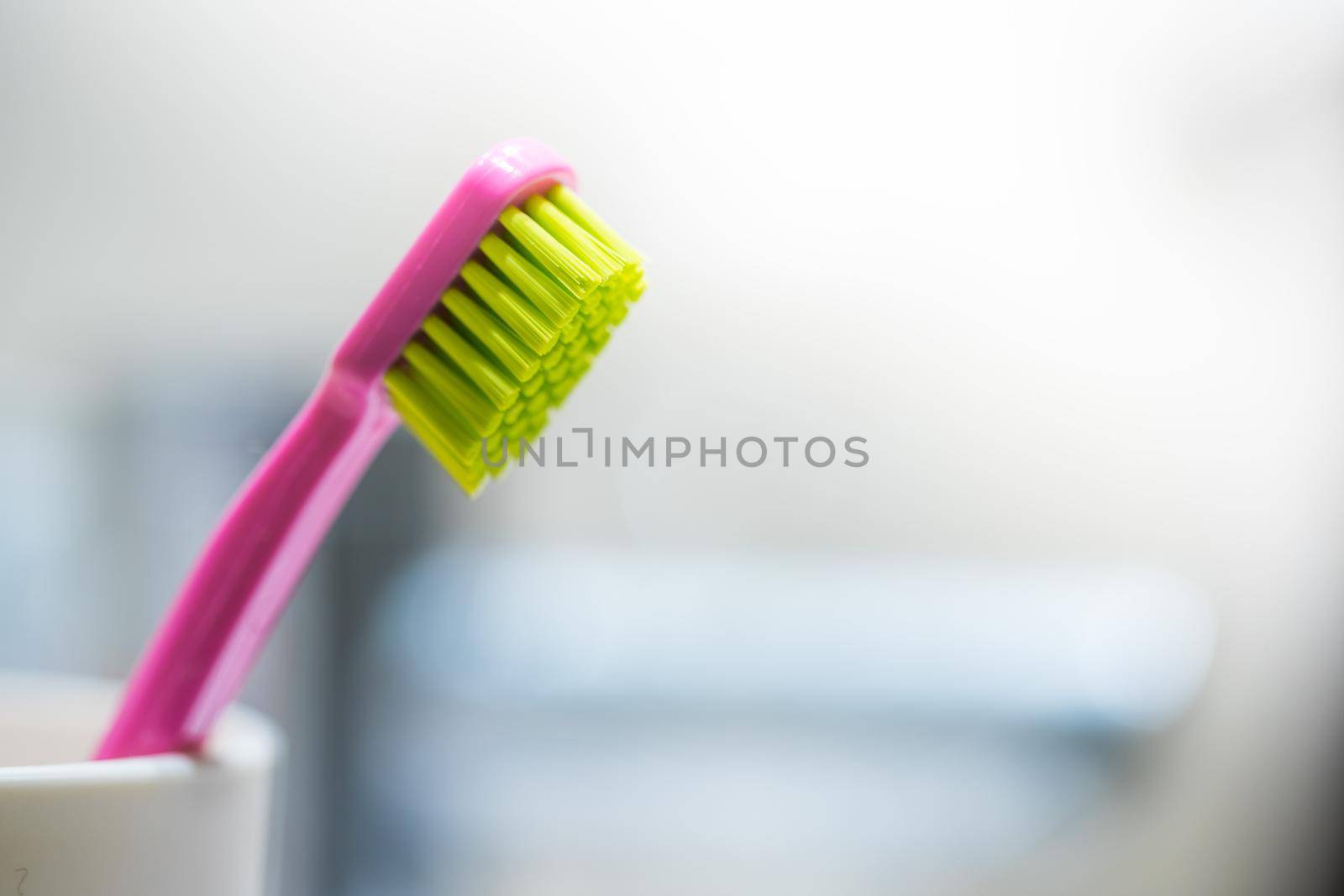 Colorful toothbrush in the bathroom, morning routine
