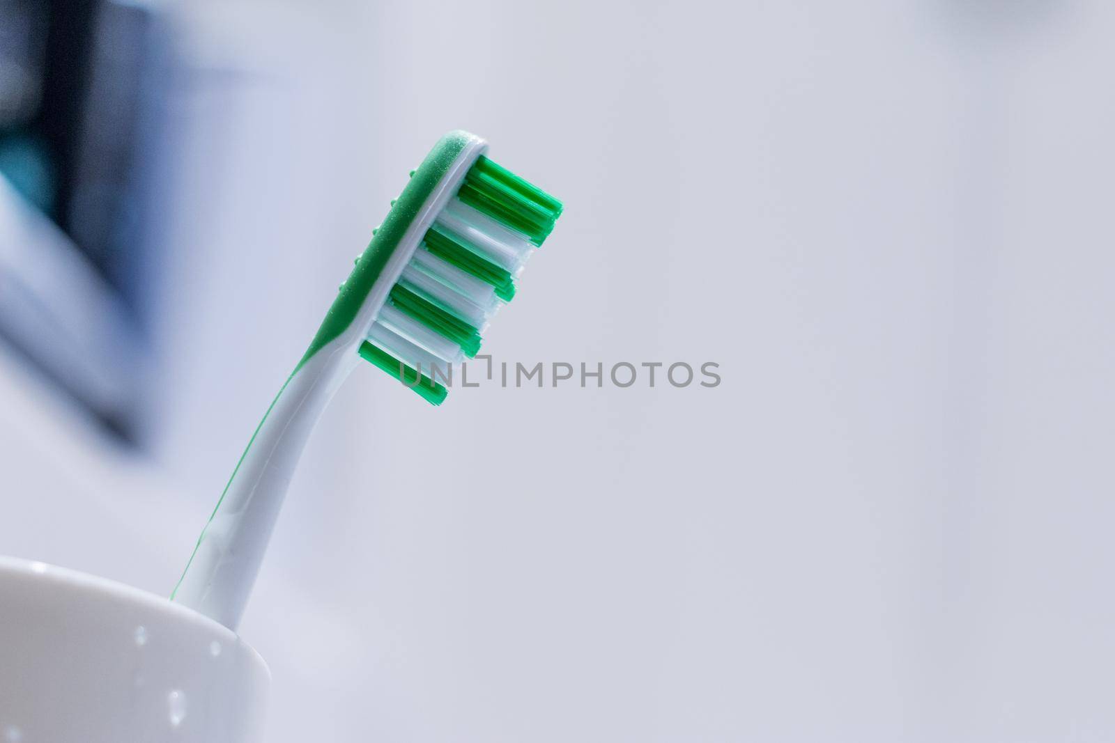 Brushing the teeth: Toothbrush in the bathroom by Daxenbichler