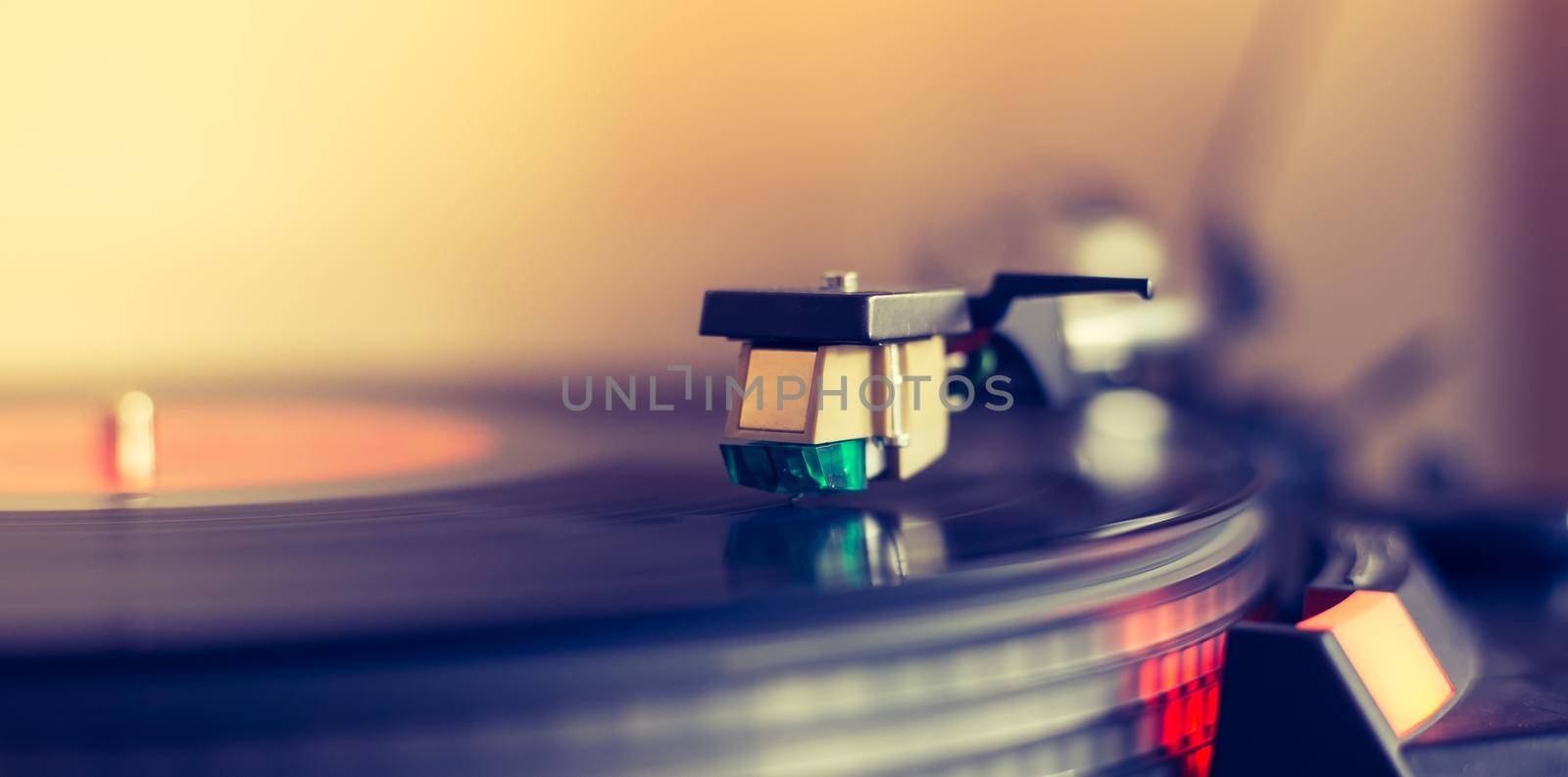 Close up picture of a record player, playing a record