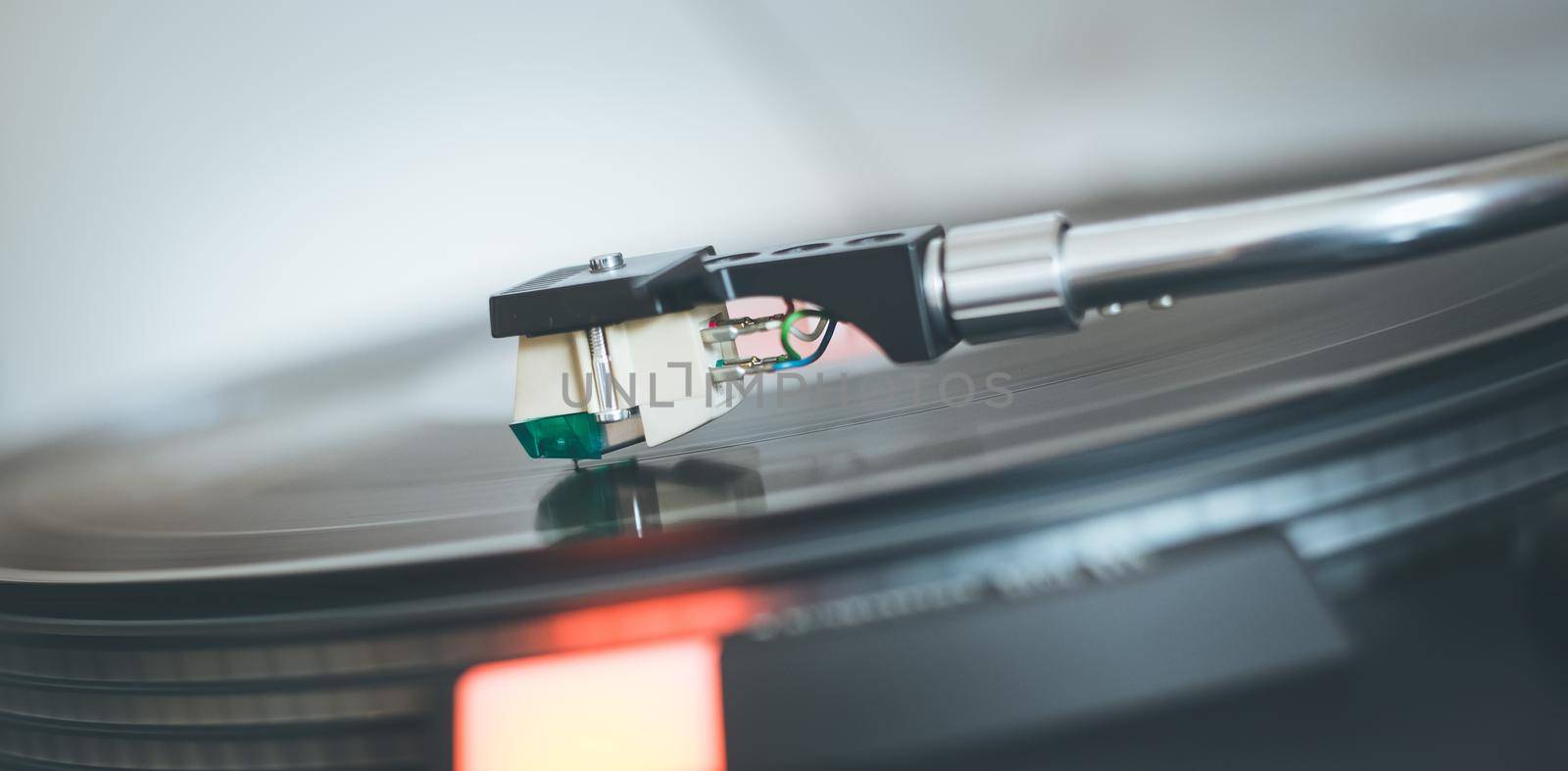 Close up picture of a record player, playing a record