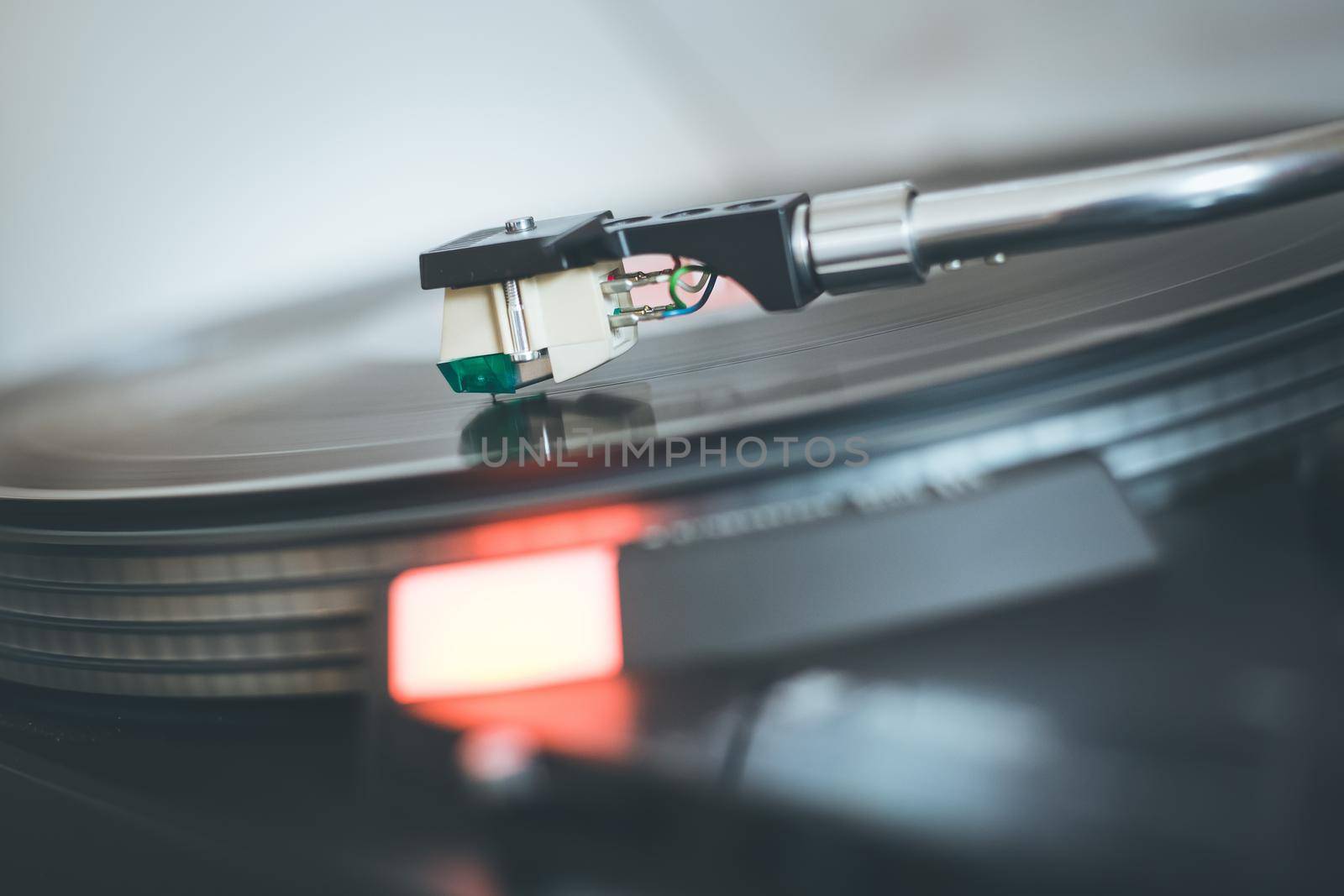 Close up picture of a record player, playing a record