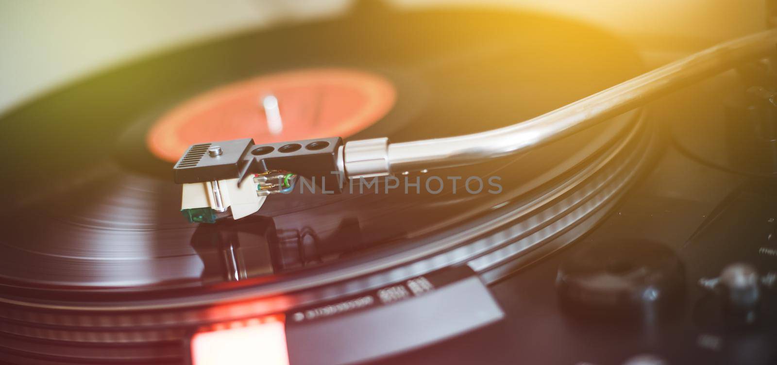 Close up picture of a record player, playing a record